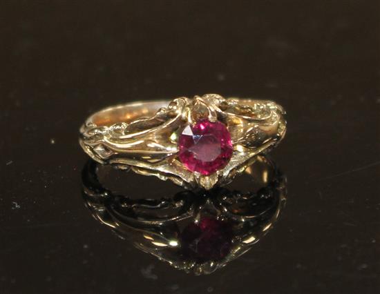 A late Victorian yellow metal and claw set solitaire garnet ring, size J, gross 4.2 grams.